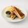 Ham & Cheese Toasties served with pickles & potato crisps